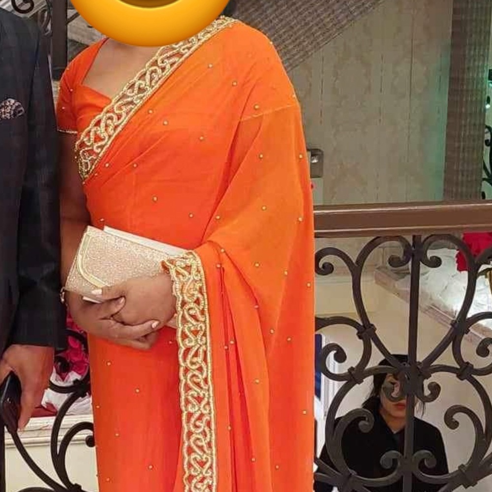 Orange georgette Saree with embellished border